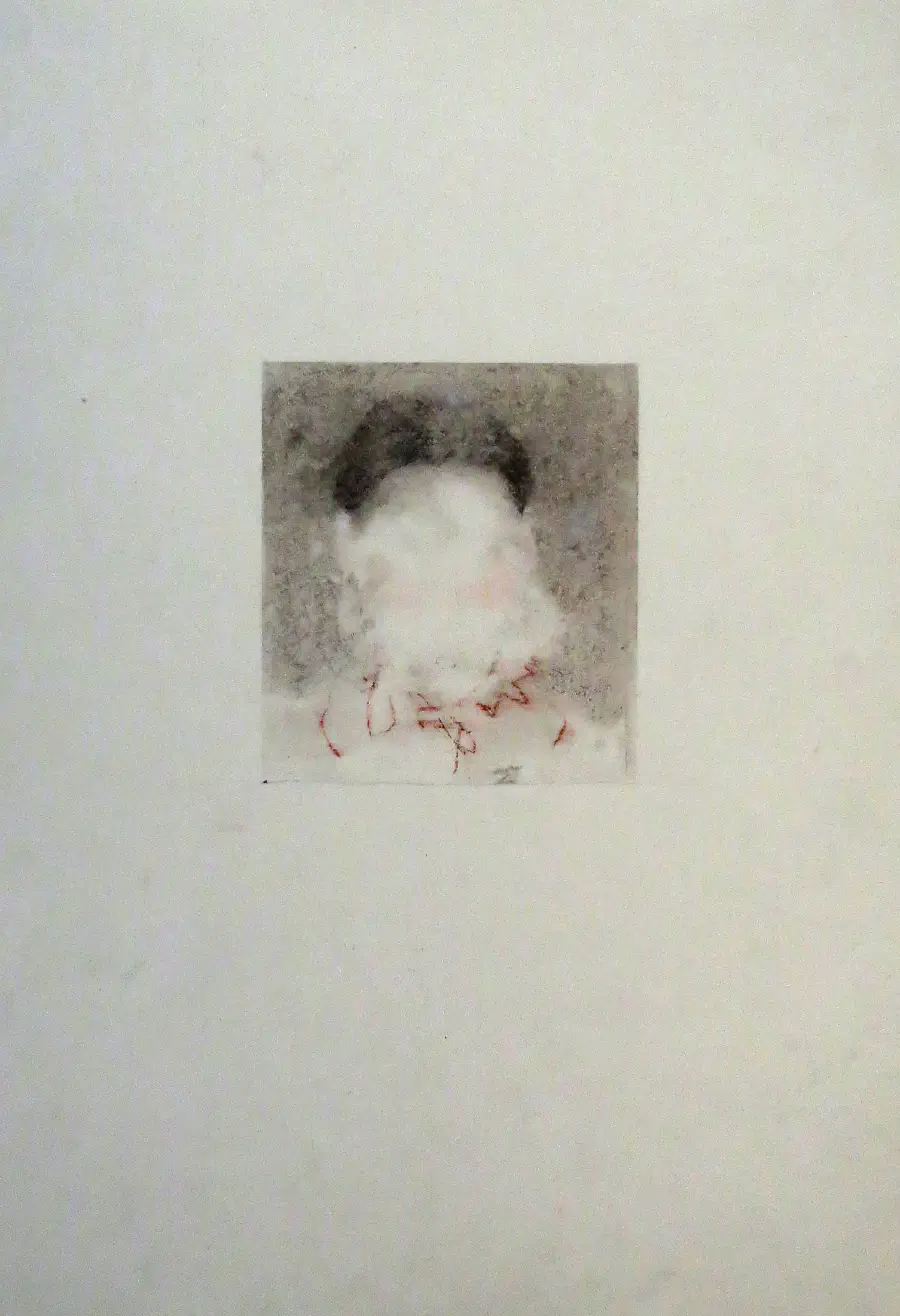 An abstracted image of a person whose face is blurred out.
