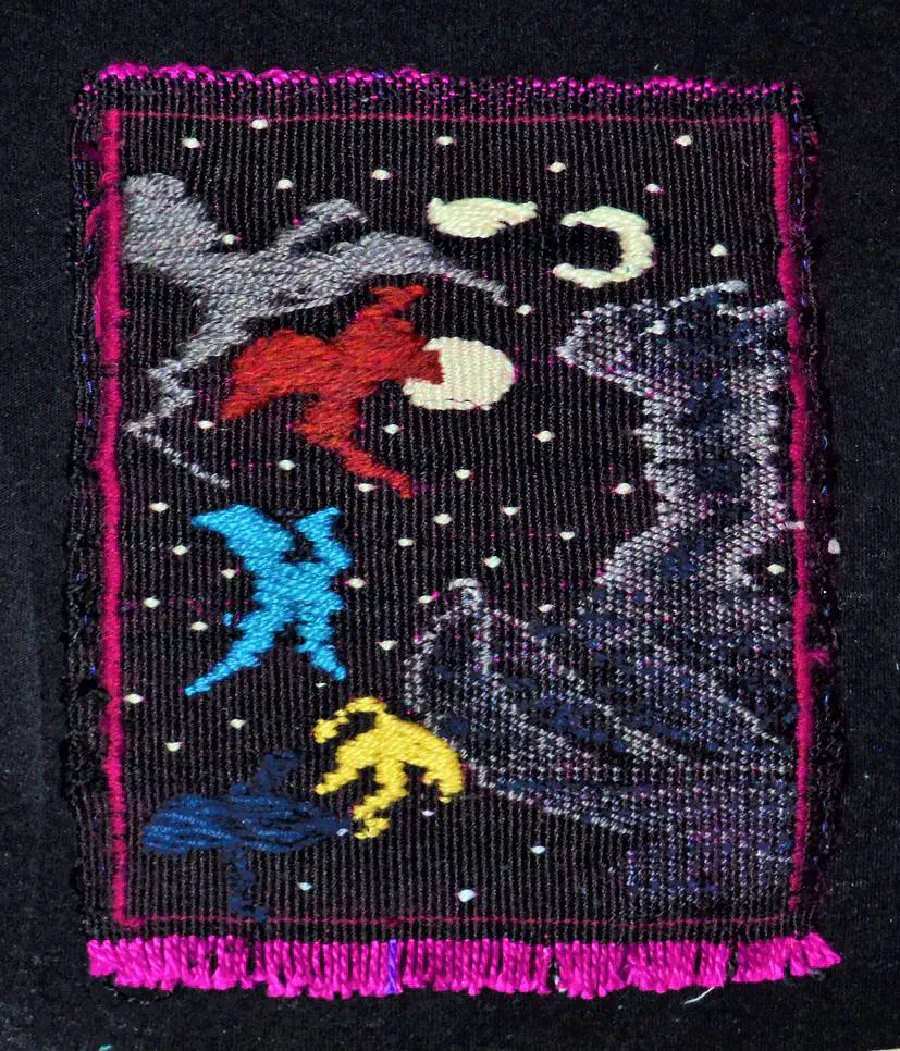 An embroidered scene of nighttime with mysterious bird-like colorful creatures to the side.